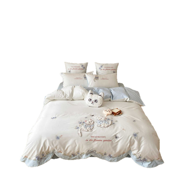 Embroidered bedding set with cat motif, wavy ruffle and reversible function
