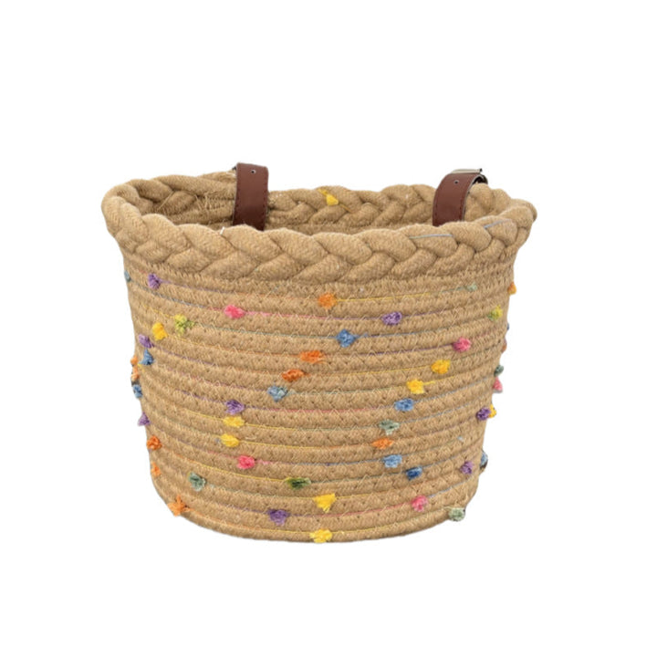braided rope bike basket with pom pom embellishments and leather handlebar straps Stornfield