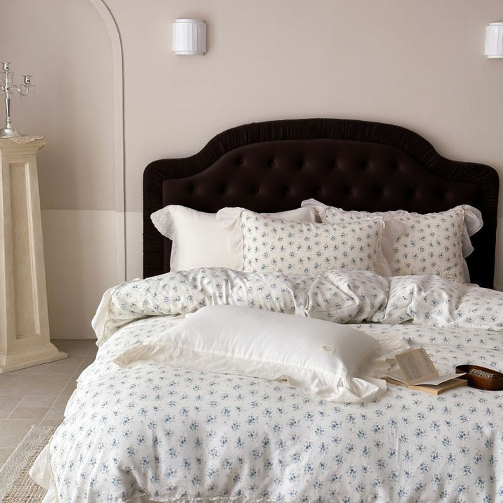 Luxurious cotton satin bed linen set in vintage style with delicate floral pattern and lace trim