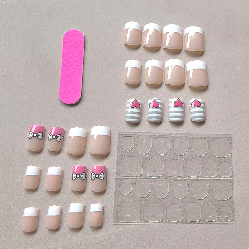 Artificial nails with playful heart and bow pattern Stornfield