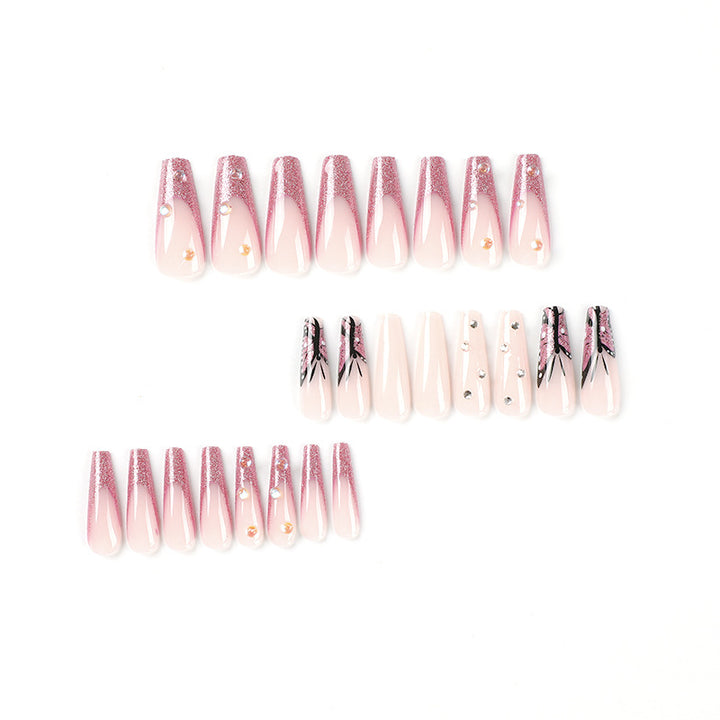 Artful stiletto nails with floral and glittering accents Stornfield