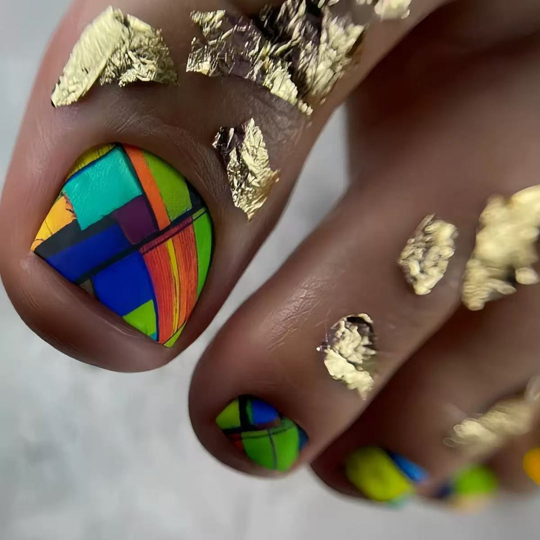 Creative toenail design with modern geometric patterns and golden accents Stornfield