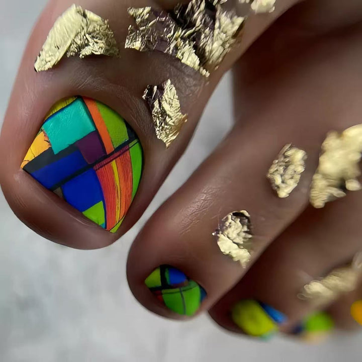 Creative toenail design with modern geometric patterns and golden accents Stornfield