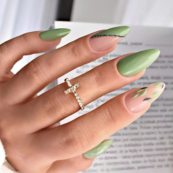 Artful nail extensions with an elegant leaf pattern Stornfield