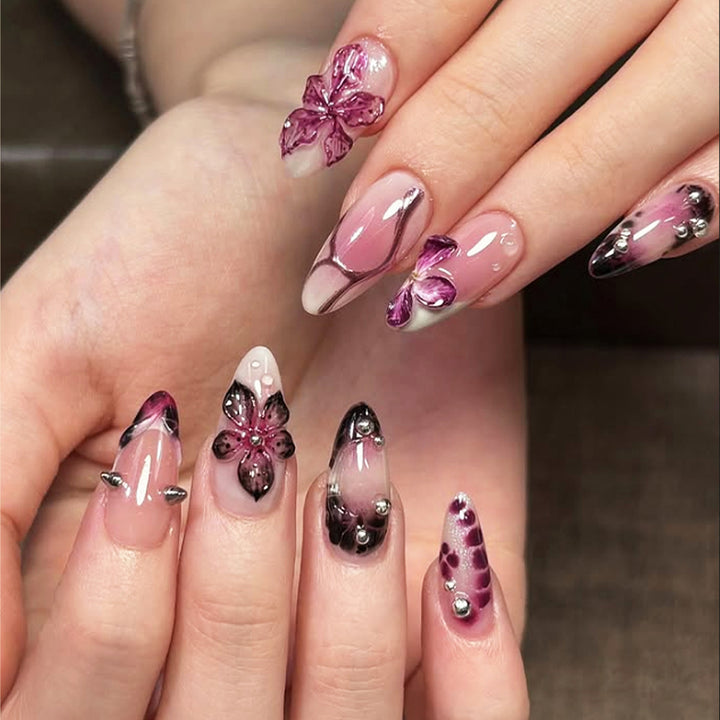 Acrylic nail set with elegant floral design and glossy accents Stornfield