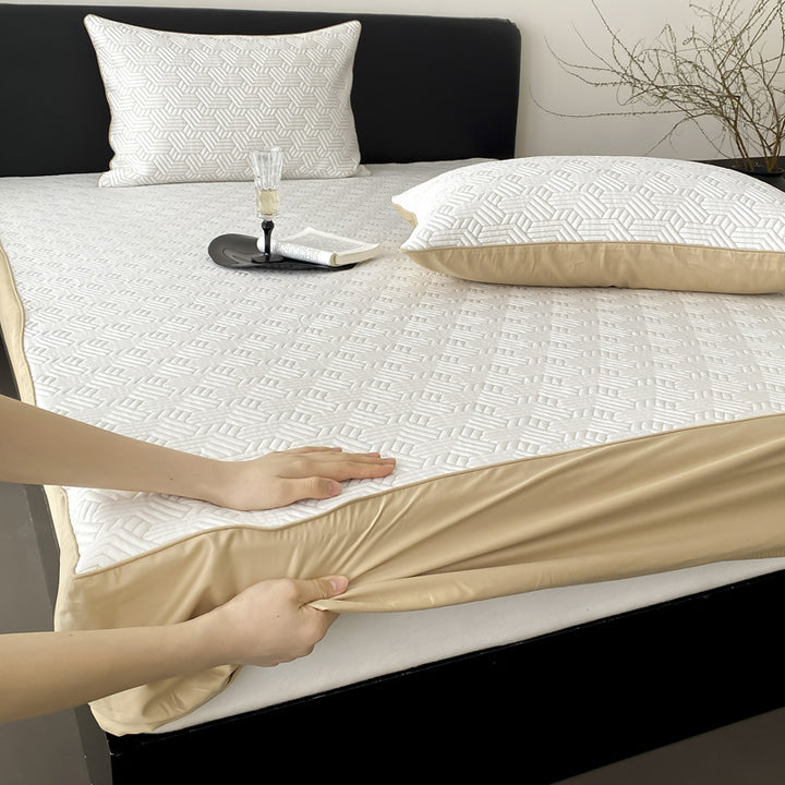 Quilted mattress protector with all-round elastic and floral relief structure