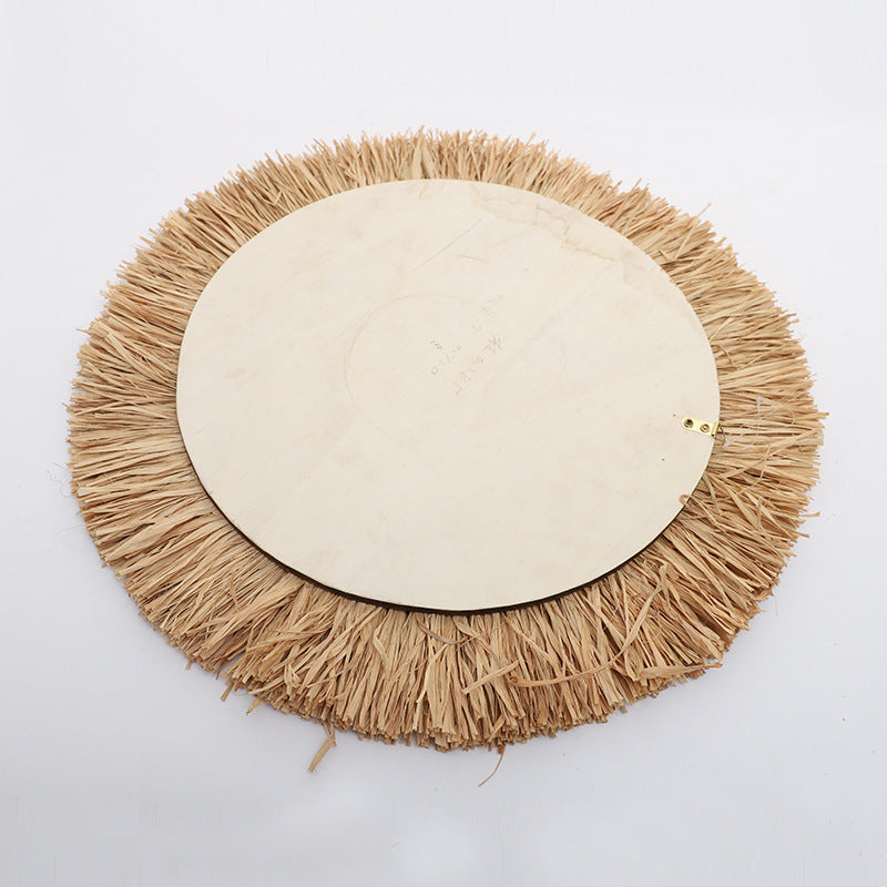 Decorative wall mirror with natural rattan frame Stornfield