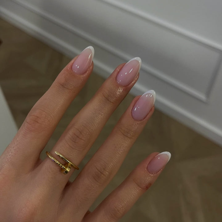 Artful nail extensions with elegant gradient and precise French tip Stornfield