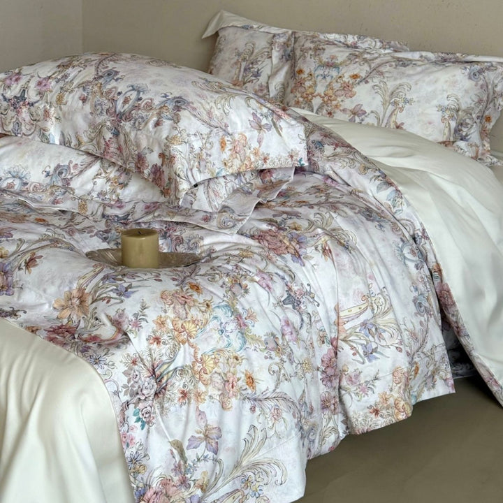Fine cotton satin bed linen set with watercolor floral ornamentation and hotel closure