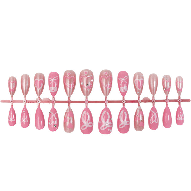 Premium artificial nail set with romantic heart and bow designs Stornfield