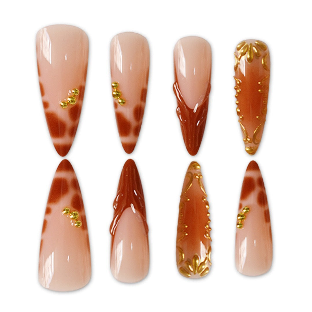Elegant Stiletto Nail Art Enhancements with Artistic Details Stornfield