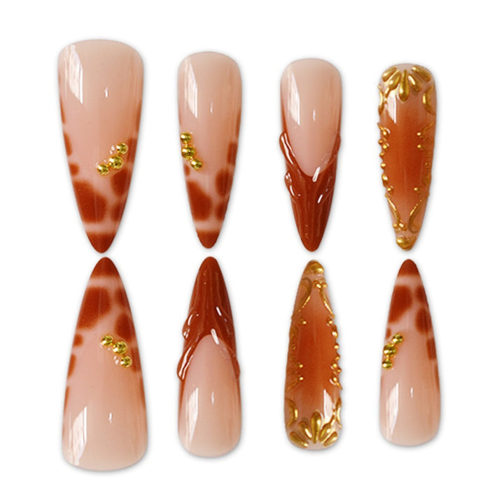 Elegant Stiletto Nail Art Enhancements with Artistic Details Stornfield