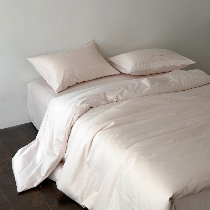 Finely woven cotton bedding set with embroidered animal border