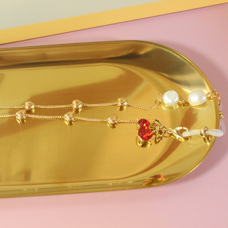 Elegant jewelry ribbon with pearls and silver accents Stornfield