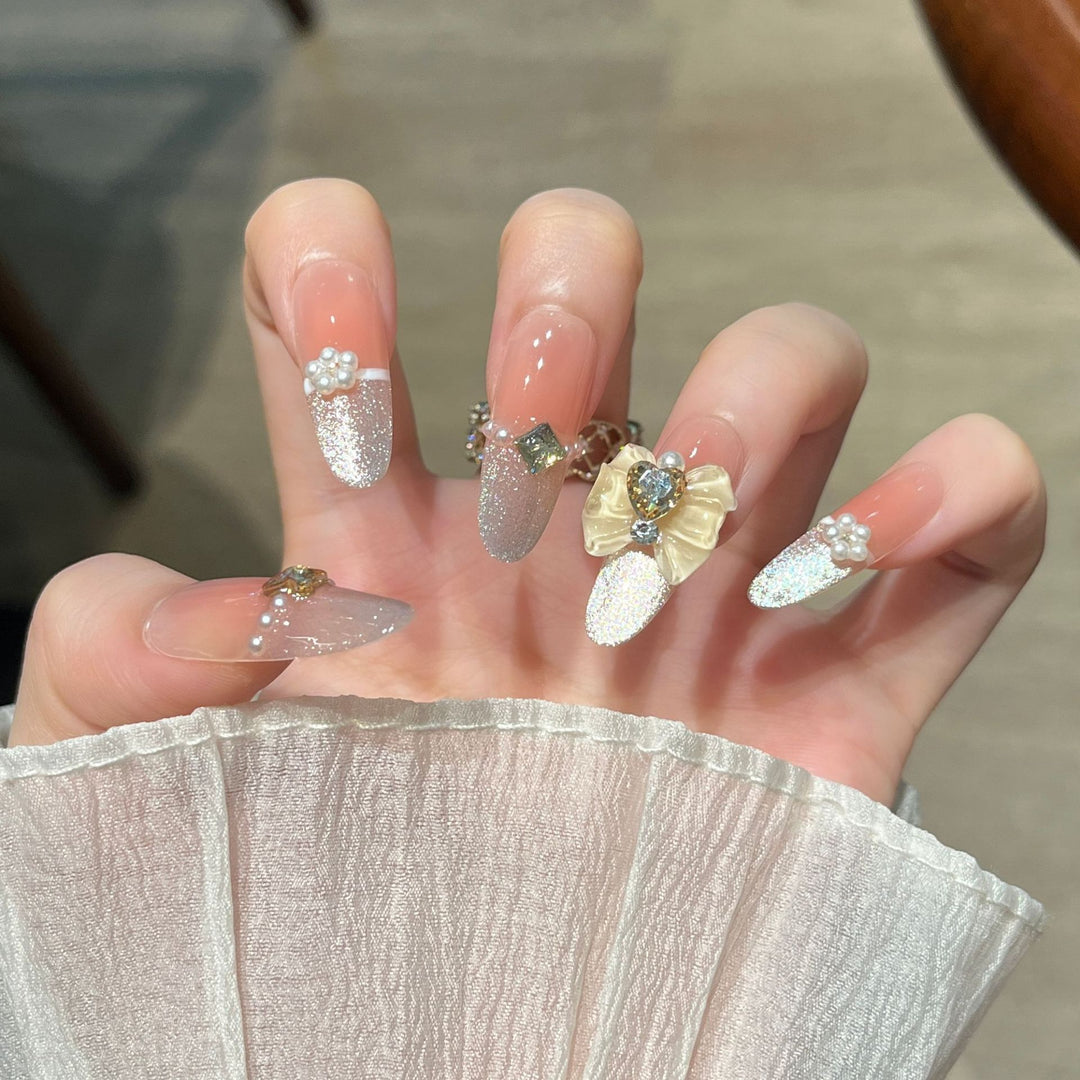 Elegant Nail Art Extensions with Pearl Accents Stornfield