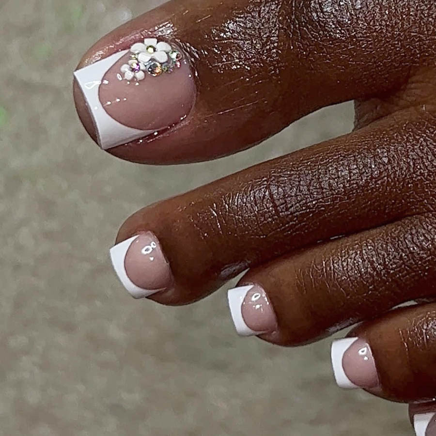 Artificial nail set with elegant French tip design and sparkling accents Stornfield