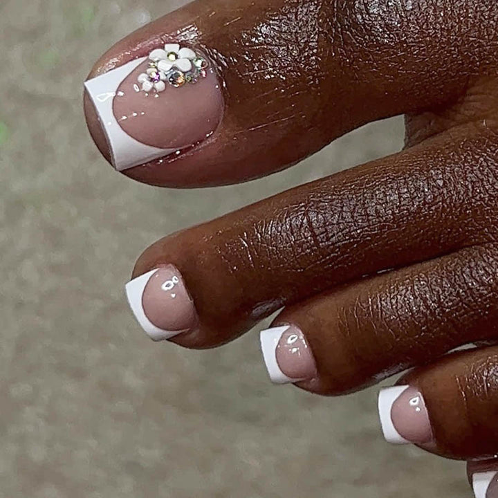 Artificial nail set with elegant French tip design and sparkling accents Stornfield