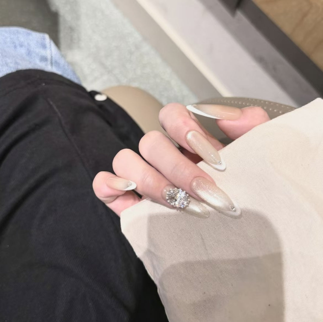 Elegant Stiletto Nail Extensions with Rhinestone Accents
