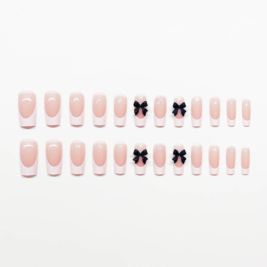 Acrylic nail set with stylish black and pearl details Stornfield