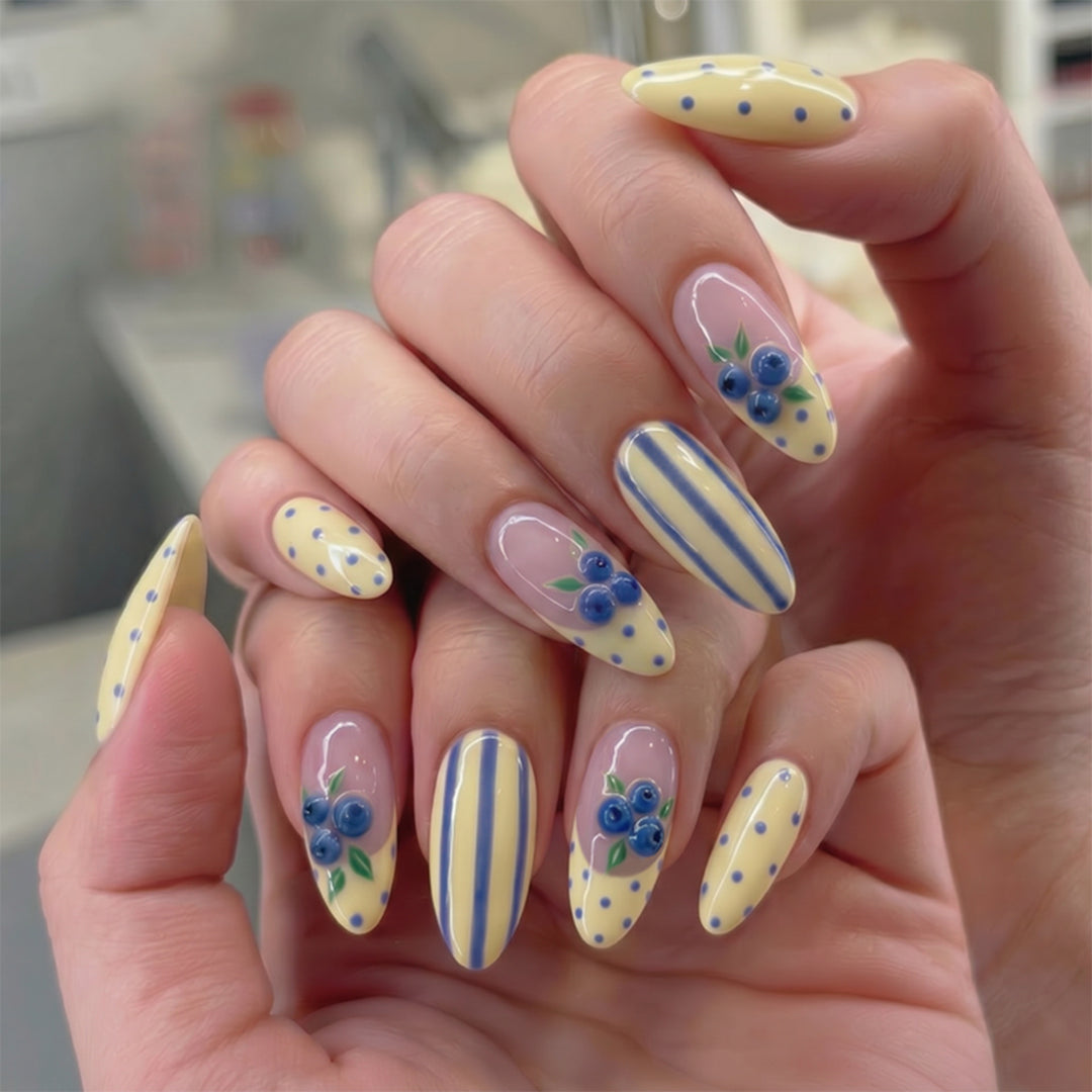 Artful stiletto nails with floral accents and colorful patterns Stornfield