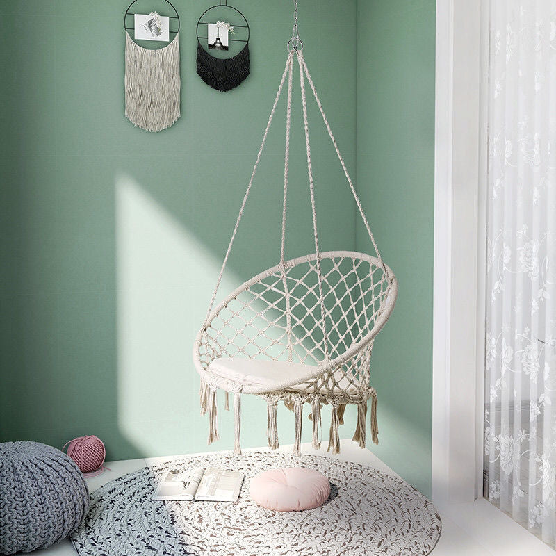 Boho macrame hanging swing chair with faux fur cushion and fringe Stornfield
