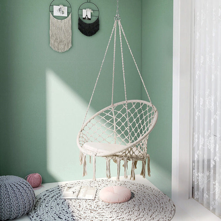 Boho macrame hanging swing chair with faux fur cushion and fringe Stornfield