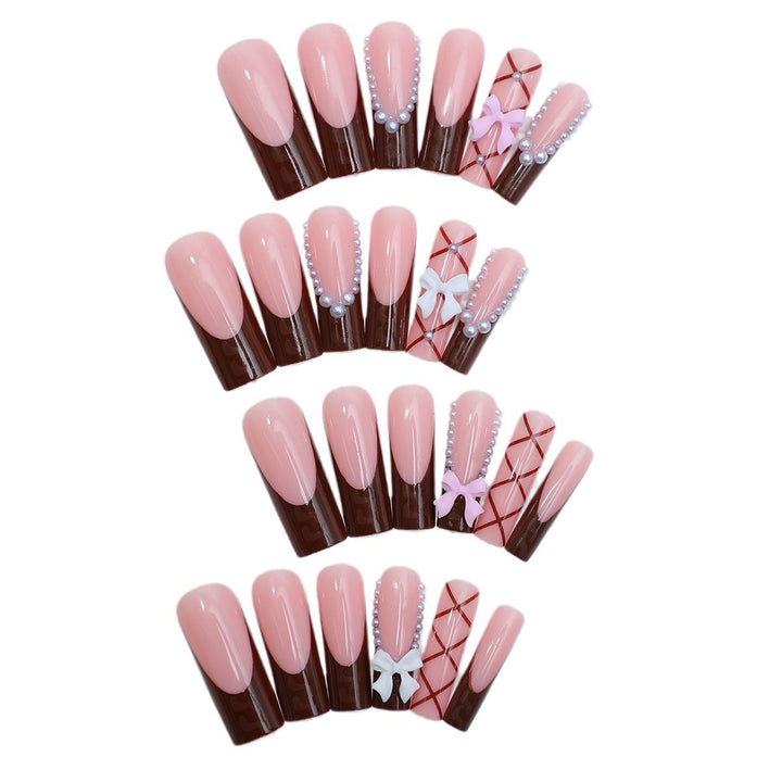 Creative nail art set with stylish bow and glitter accents Stornfield