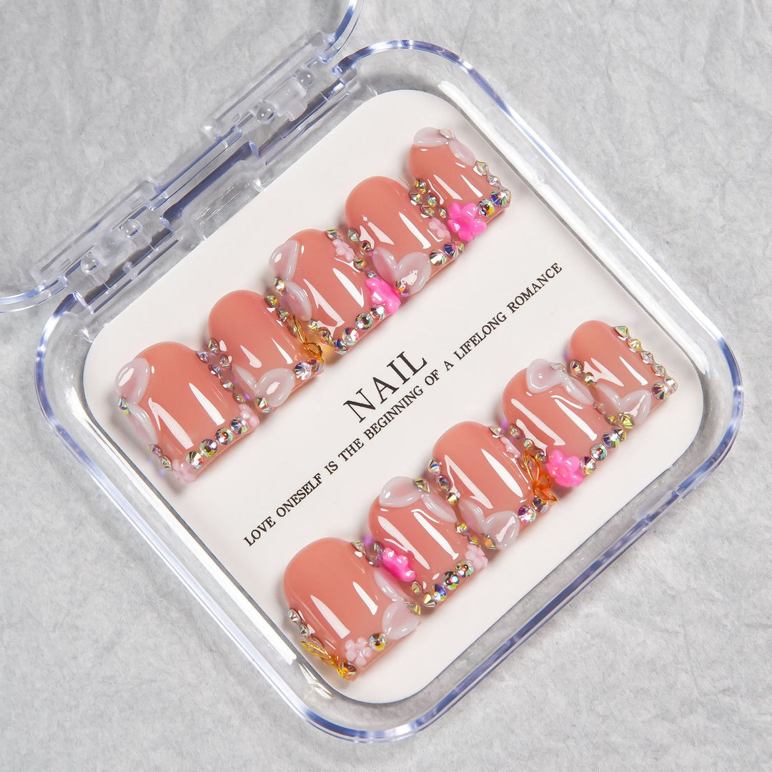 Decorative Press-On Nail Set with Soft Pink Accents and Gem Details
