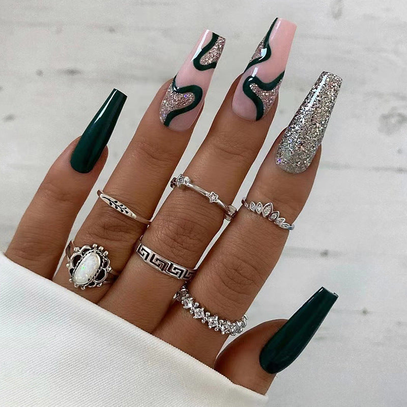 Artificial nail art with elegant glitter and gradient effects Stornfield