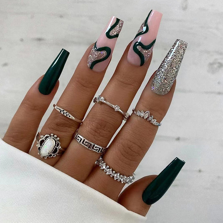 Artificial nail art with elegant glitter and gradient effects Stornfield