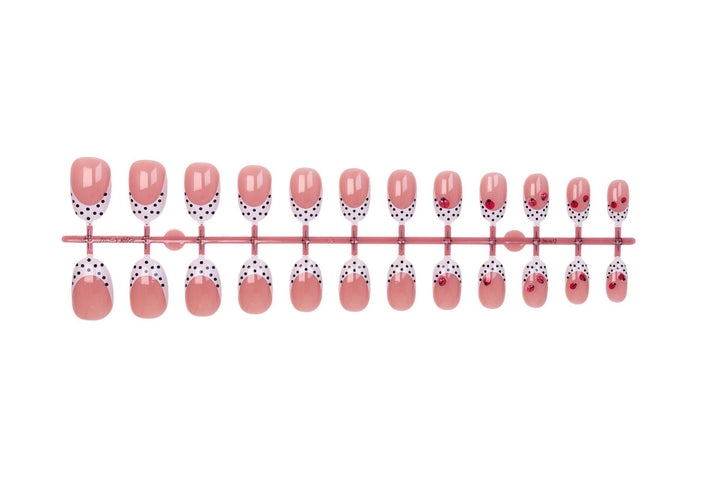 Artificial nail set with playful dots and eye-catching accents Stornfield