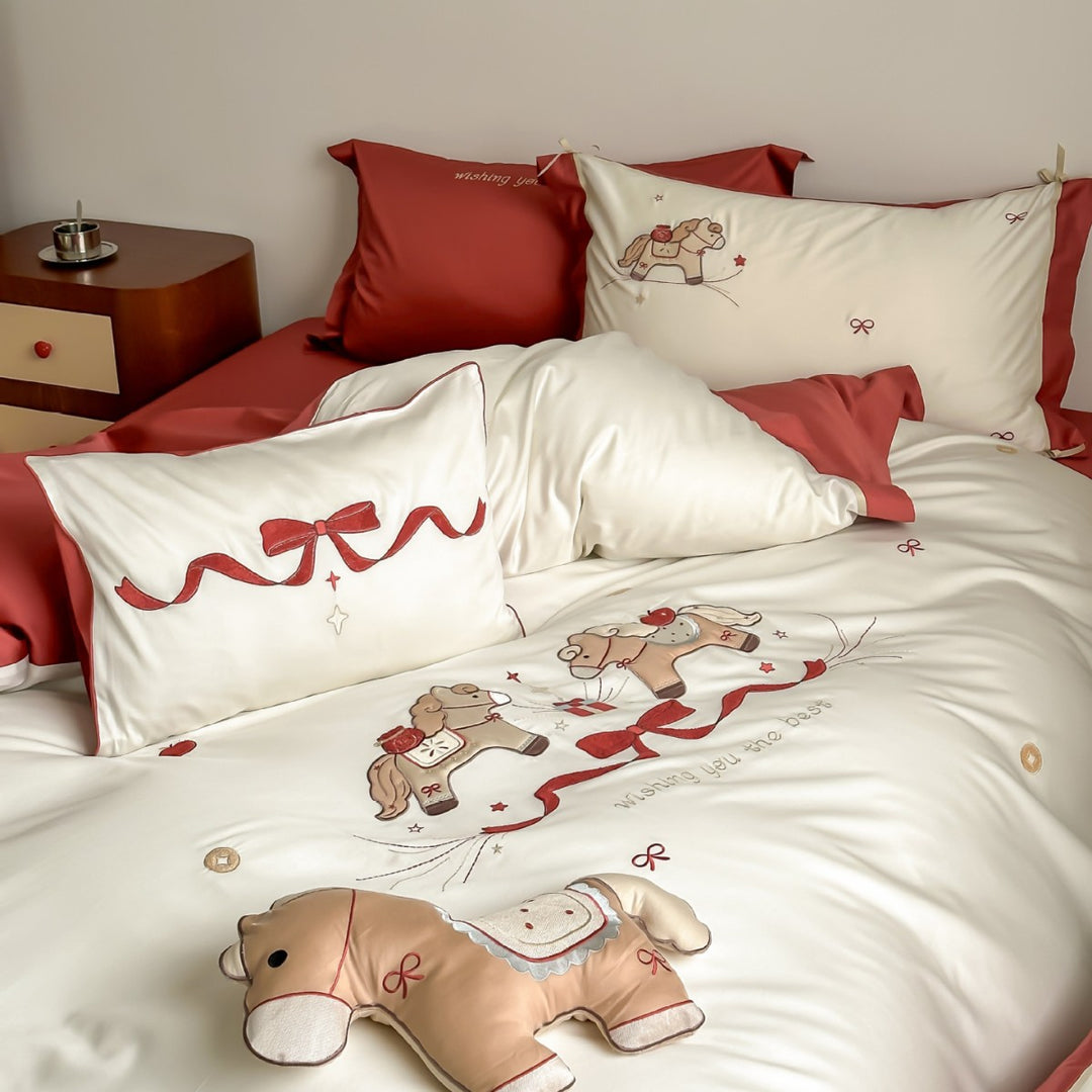 Satin bedding set with embroidered rocking horse motif
