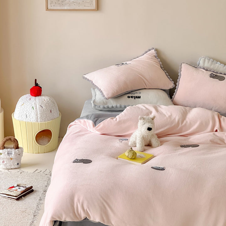 Bedding set with embroidered motif details, pompom trim and soft woven cotton finish