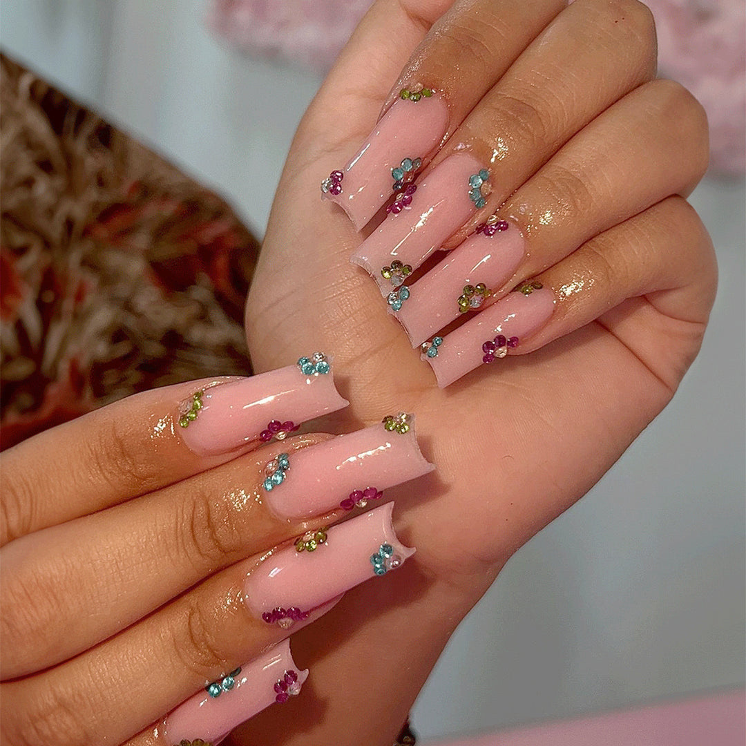 Artificial nail tips with colorful flower accents Stornfield