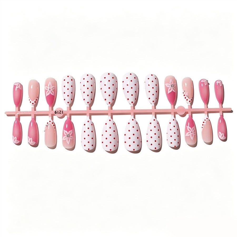 Artificial nail set with floral accents and charming polka dots Stornfield