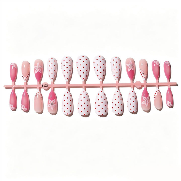 Artificial nail set with floral accents and charming polka dots Stornfield
