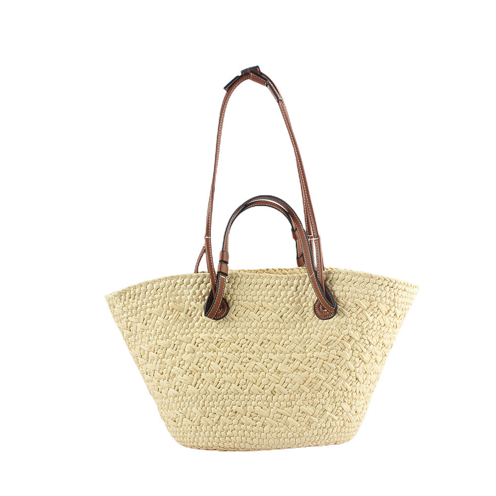 Elegant handbag made of woven natural material with sturdy leather handles Stornfield