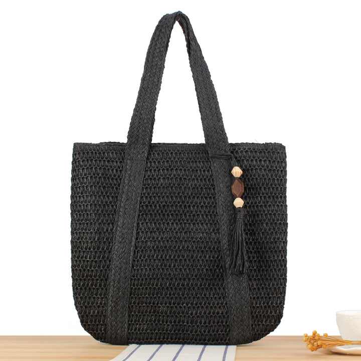 Eco-friendly straw tote bag with elegant tassel detail Stornfield