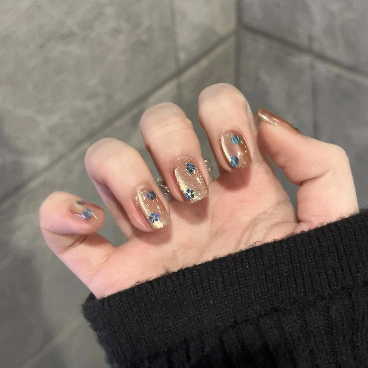 Glittering artificial nails with floral design Stornfield