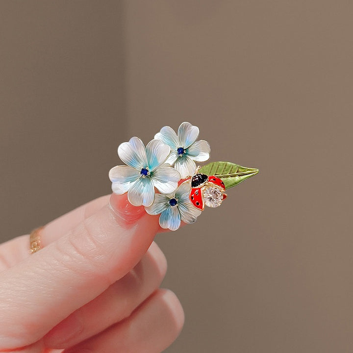 Flower brooch with ladybug and crystal Stornfield