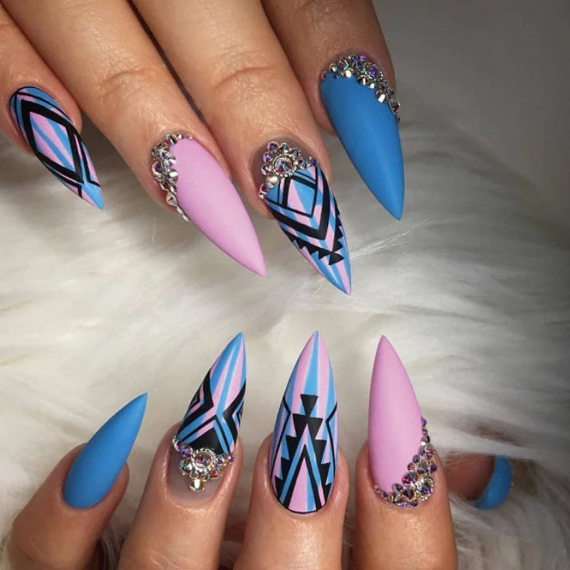 Artful stiletto nails with modern geometric designs and rhinestone embellishments Stornfield