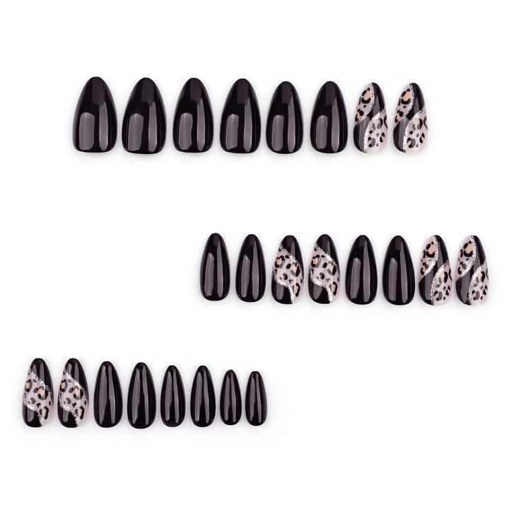 Artistic stiletto nails with leopard design and glitter effects Stornfield