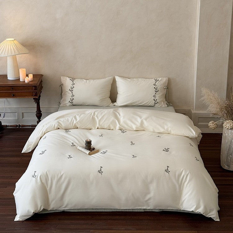 Luxurious cotton bedding set with fine embroidery and lace trim