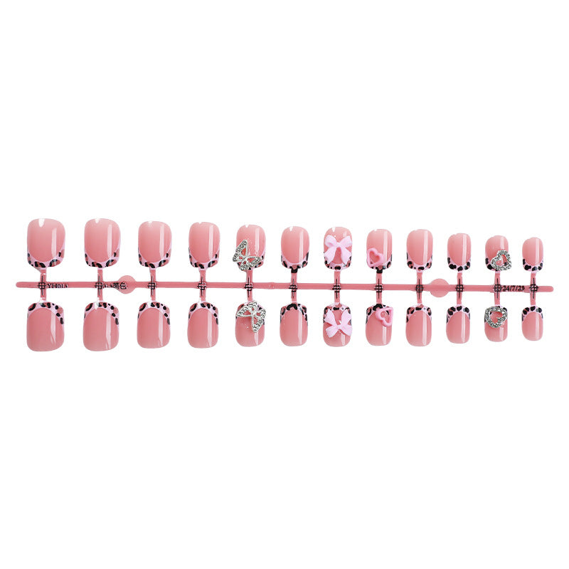 Decorative Press-On Nail Set with Artistic Bow and Heart Accents Stornfield
