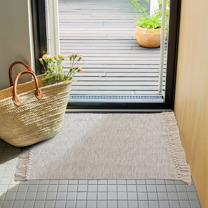 Braided runner rug with herringbone pattern and fringe edge Stornfield