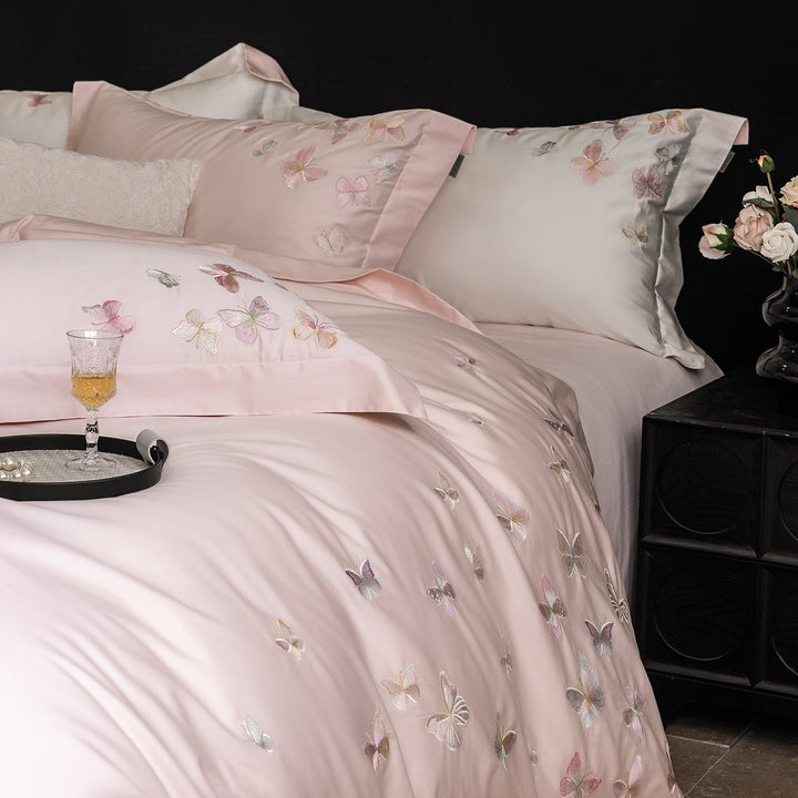 Premium bedding set made of extra soft cotton satin with delicate butterfly embroidery and concealed hotel closure