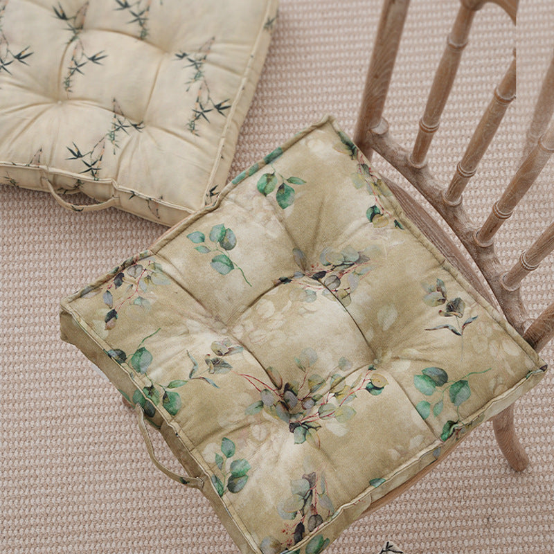 Padded seat cushion with tufting and bamboo motif