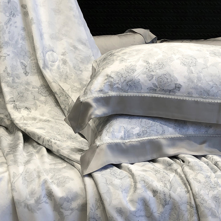 Pillowcase set made of cotton satin with delicate lace trim and satin piping