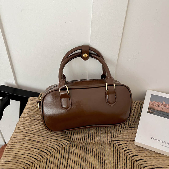 Vintage-Inspired Glossy Handheld Satchel
