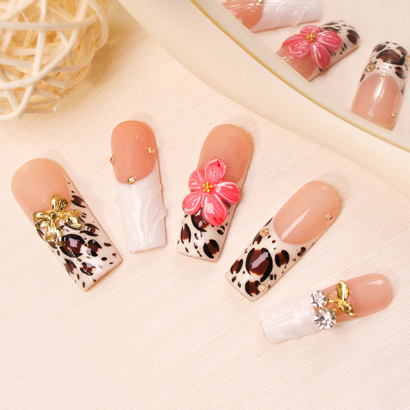 Nail set with elegant leopard and flower embellishments Stornfield